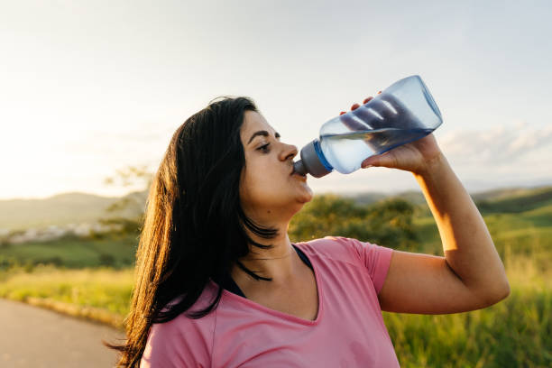 istock Break on the walk to drink water 1308025894