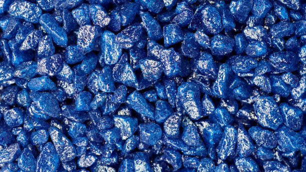 Blue glitter stones for garden decoration Blue gemstone fake pattern. Blue glitter stones for garden decoration, flat lay, top view background. blue saphire stock pictures, royalty-free photos & images