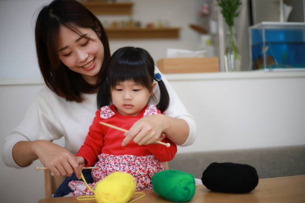 istock Parents and children knitting 1308028396