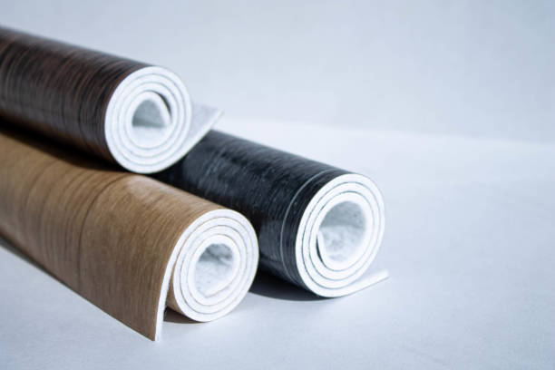 istock Linoleum. Three rolls of linoleum on a white background. 1308029224
