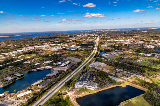 Aerial view of Interstate 95 northbound toward the city of Jacksonville, Florida with the skyline of the city visible in the distance.