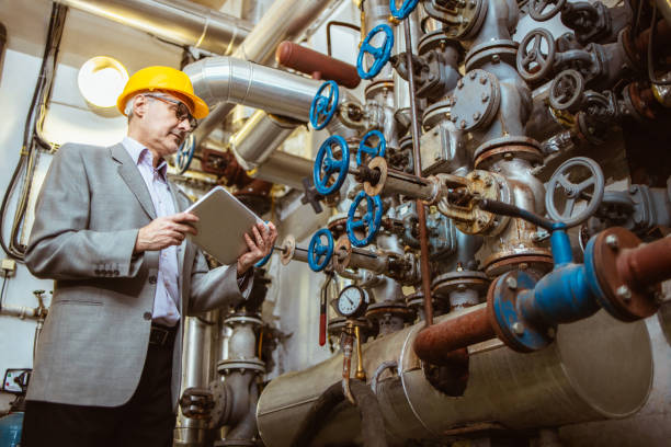 istock Engineer with a safety helmet checks the operation of the system 1308030962