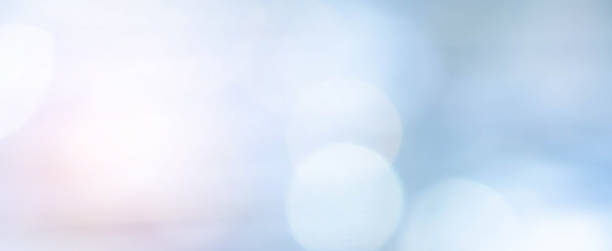 istock abstract blurred glowing blue color background with bokeh bulbs and orange light effect for design concept 1308037339