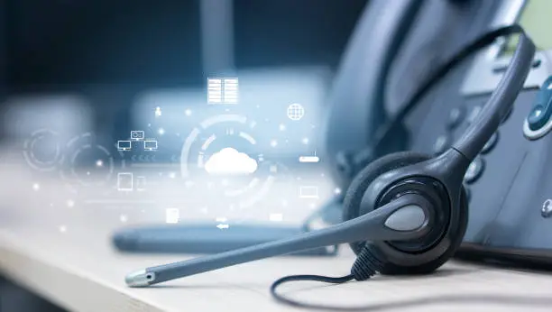 Photo of close up on headset telephone with cloud data center to synchronize on SaaS host server to working on system for futuristic technology and business marketing concept