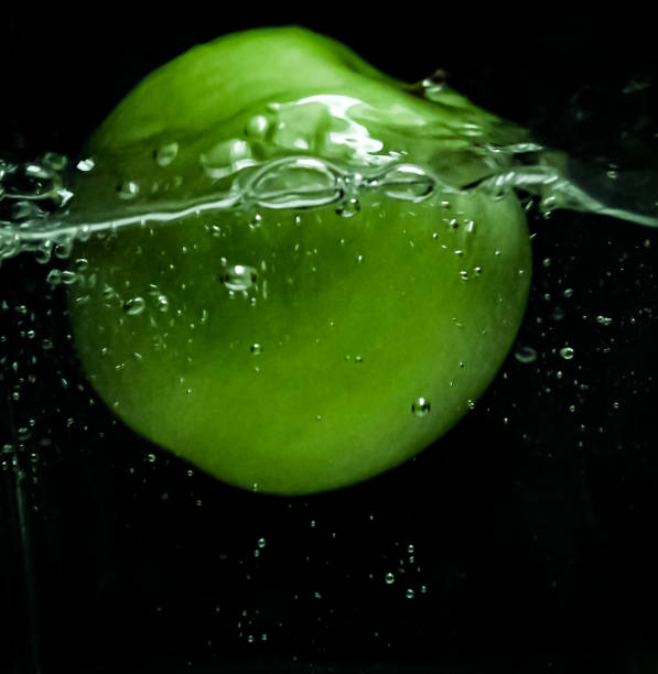 istock An apple falls into the water 1308041125