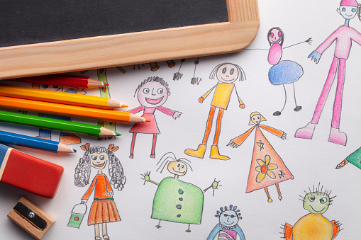 Children's drawings with blackboard and colored pencils.