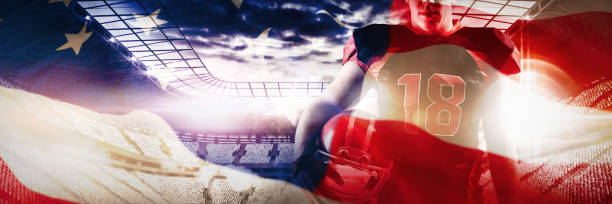 istock Composite image of volleyball player holding rugby helmet 1308043045
