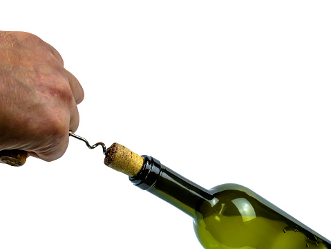 Open the cork of a wine bottle with a hand corkscrew. Wine corkscrew. Cork stopper. Human hand. Kitchen tool. Opener bar tool. Drinking establishment. White background.