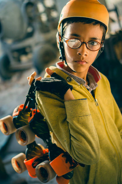 istock Teenage boy with roller skates. 1308044699
