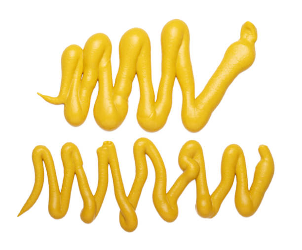 istock Mustard yellow tasty sauce isolated on a white background 1308045578