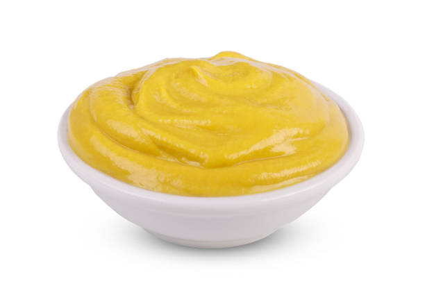 istock Mustard tasty sauce in bowl isolated on white background. 1308045603