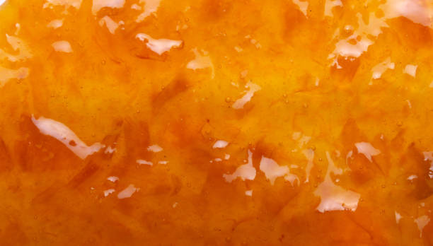 fond savoureux délicieux de texture de confiture d’orange vers le haut - gelatin dessert orange fruit marmalade photos et images de collection