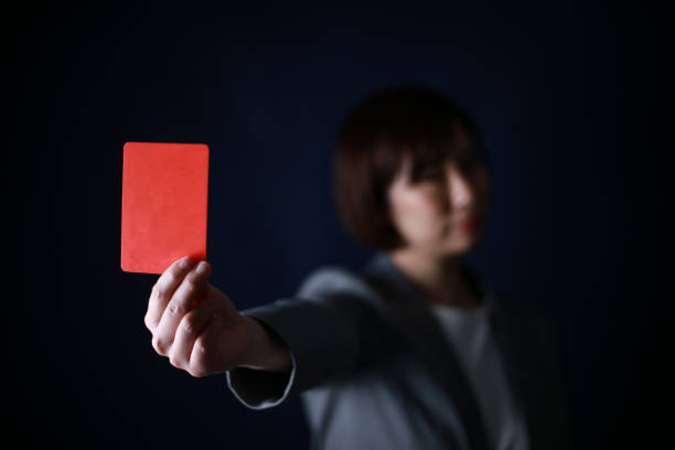 istock Female employee issuing a red card 1308046324