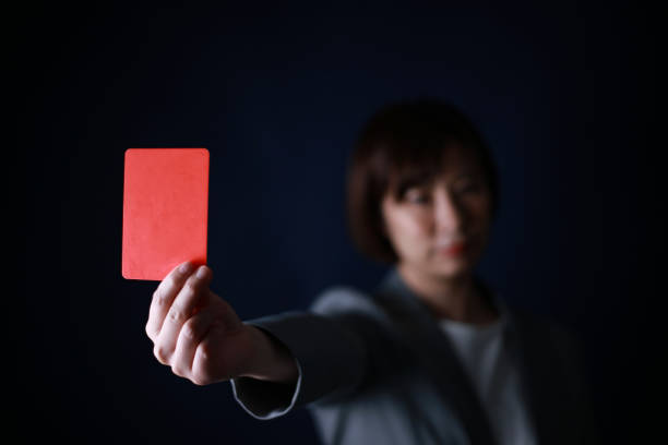 istock Female employee issuing a red card 1308046691
