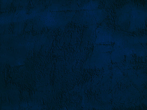 istock Toned concrete wall background. Decorative plaster texture. Dark blue abstract background with copy space for design. 1308047556