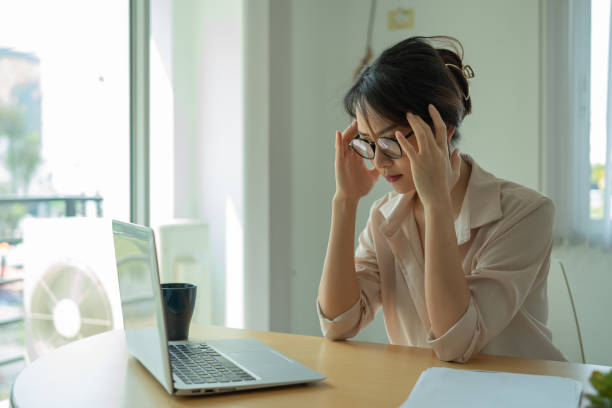 istock Asian businesswoman gets stressed while having a problem at work in the office. 1308049354