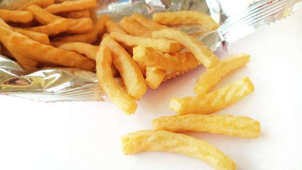 istock Crunchy prawn crackers on white background. 1308050279