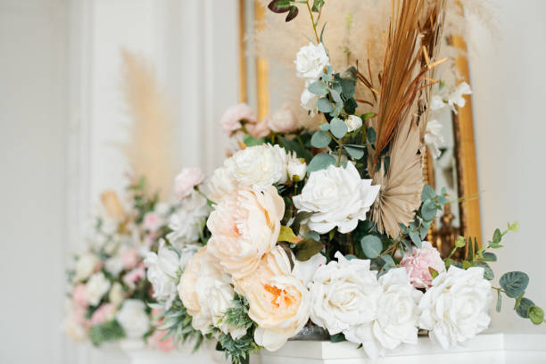istock Wedding decorations with flowers. Beautiful flower composition in classic interior. Decoration of a banquet at a wedding with flowers. 1308053293