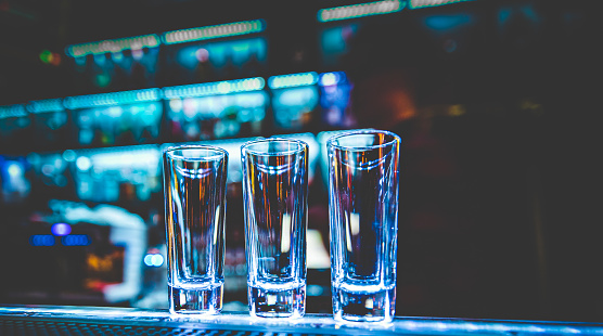 Empty glasses for shots on bar counter