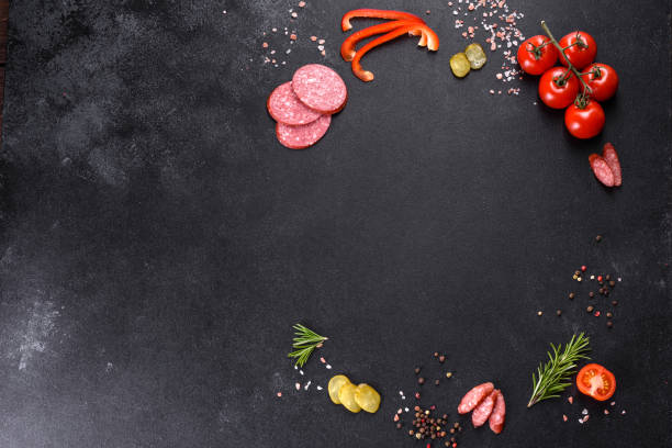istock Ingredients for making pizza with sausage tomatoes and cheese in a hearth oven 1308058783
