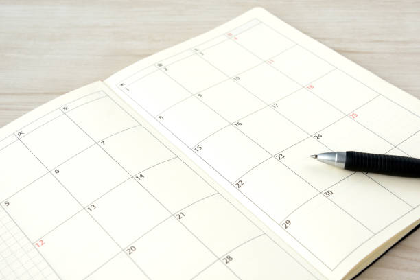 istock Business schedule book and pen on desk with nobody 1308058987