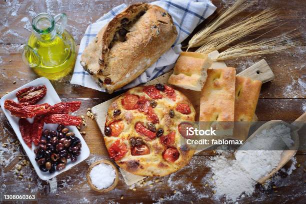 Focaccia With Cherry Tomatoes And Olives Olive Bread White Focaccia Dried Tomatoes And Olives Top View Stock Photo - Download Image Now