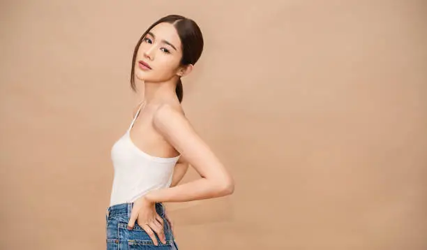 Photo of Portrait of young beautiful sexy asian korean woman slim fit body. Isolated of face fashion asian girl looking. Lifestyle japanese makeup, korea people glow skin slim fit, beauty girl next door.