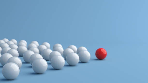 istock Leadership concept, red leader ball leading white balls, on blue background with empty copy space 1308064154