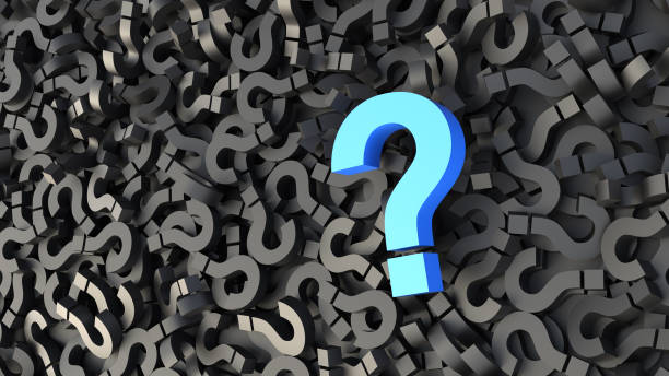 istock Big blue question mark on a background of black signs, FAQ Concept 1308064167