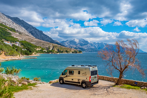 Dalmatia, Croatia - March 15, 2021: camping at Adriatic Sea with modern European van conversion .