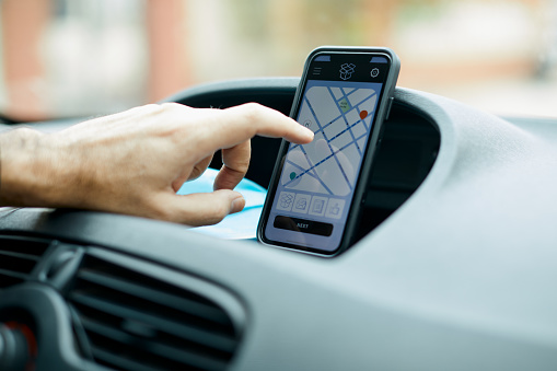 Close-up view of a smartphone with a GPS map app.