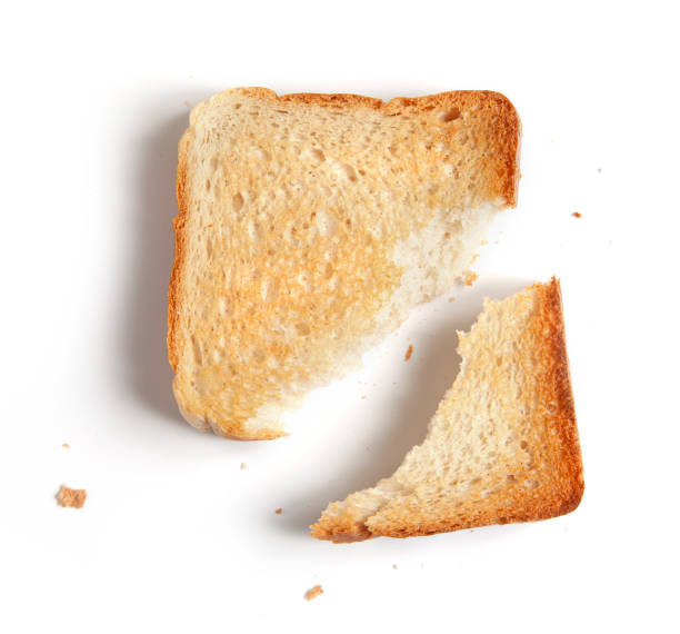 istock broken toasted bread slice isolated on white background, top view 1308067475