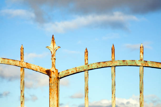 Detail of old rusty cast iron gate, entrance to an old garden and mansion. Galicia, Spain.