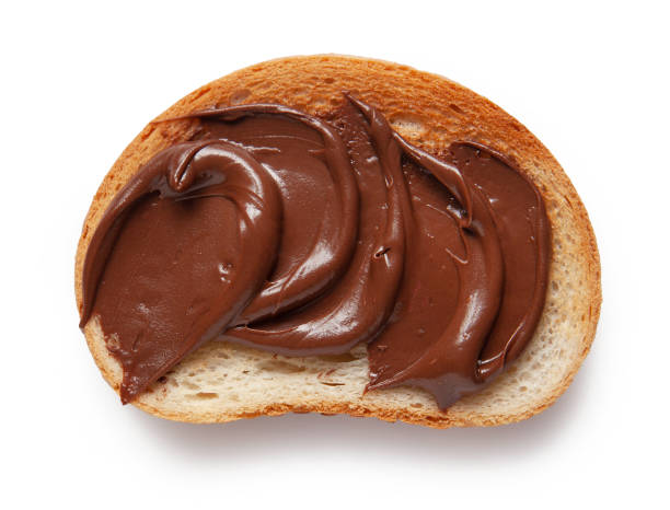 istock toasted bread with chocolate hazelnut cream isolated on white background, top view 1308067547