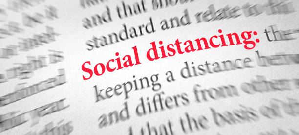 istock Definition of the word Social distancing in a dictionary 1308067921