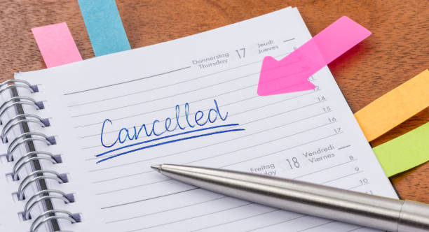 Daily planner with the entry Cancelled Daily planner with the entry Cancelled cancellation photos stock pictures, royalty-free photos & images