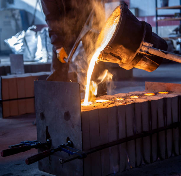 istock molten steel flow, spark burst, casting moment 1308068101