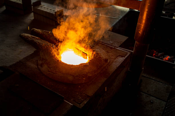 istock molten steel flow, spark burst, casting moment 1308068660