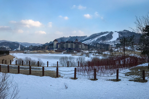 Scenic view of Alpensia Ski Resort against cloudy sky, Pyeongchang, South Korea