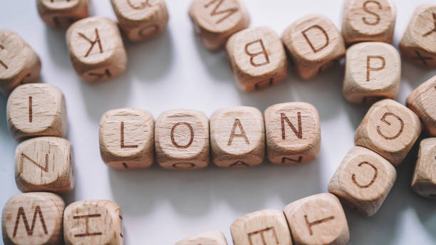 istock Loan word concept. Wooden Blocks  close up view 1308074002