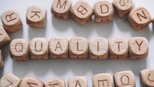 istock Quality word concept. Wooden Blocks  close up view 1308074032