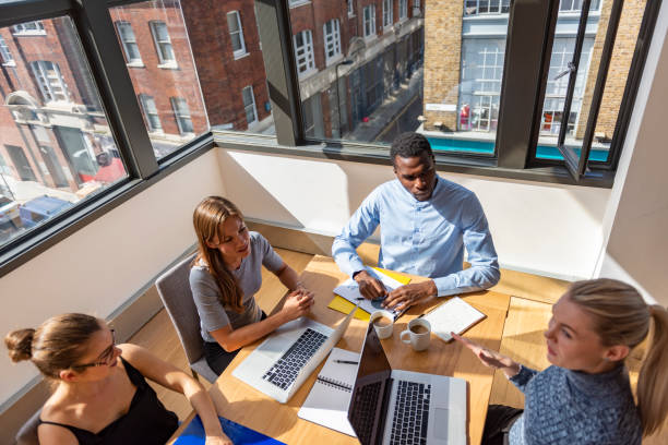istock Diverse Group of Businesspeople Sitting at Conference Table 1308074200