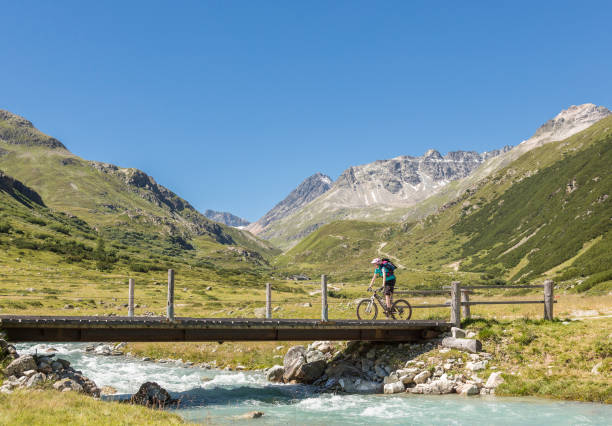 istock Crossing a creek at Bever Valley, Switzerland. 1308075318