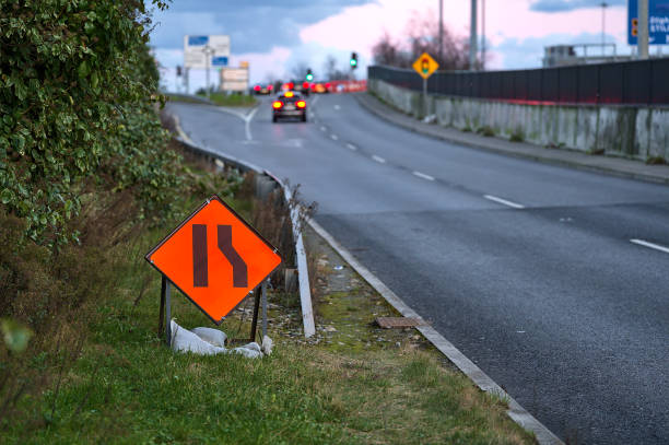 istock Temporary road sign indication road narrowing from right 1308076459
