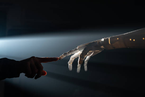 istock Human Finger Touching Robot Fingers 1308080783