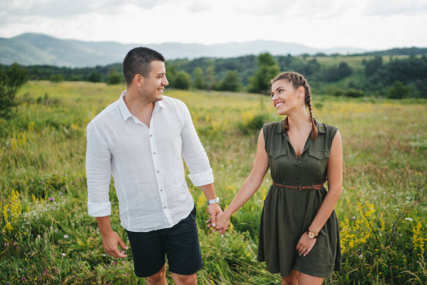 istock Loving young couple walking in spring nature 1308081367