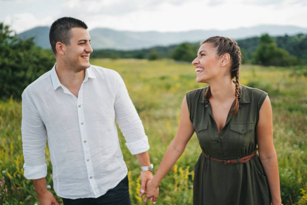 istock Loving young couple walking in spring nature 1308081384