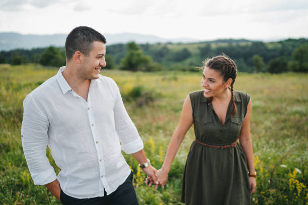 istock Loving young couple walking in spring nature 1308081445