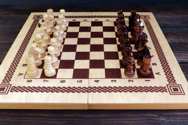 istock Chess game on a wooden background. Chess match. 1308085926