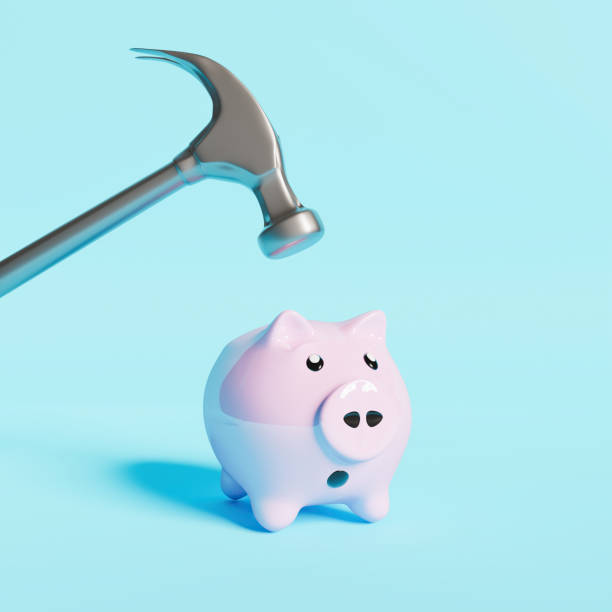 istock piggy bank with a scary face and hammer 1308087265